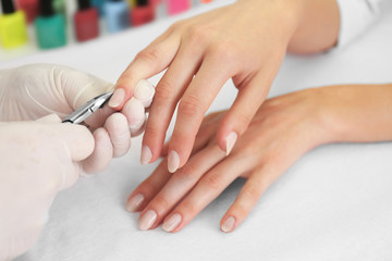 Woman getting a manicure in a beauty salon, close up