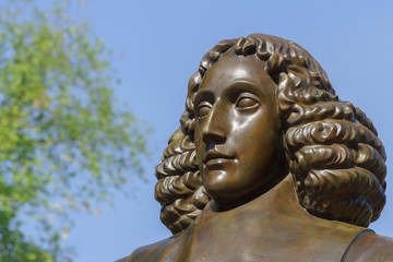 Amsterdam, the Netherlands - August 16, 2016: The famous philosopher Baruch Spinoza has his statue...