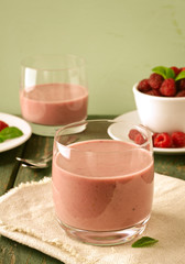 Healthy berry with raspberry, oatmeal and mint in a glass