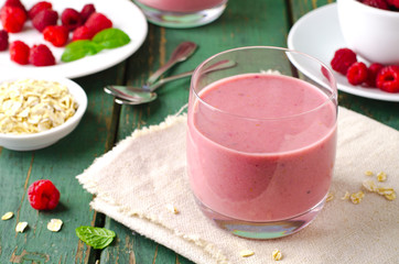 Healthy berry with raspberry, oatmeal and mint in a glass