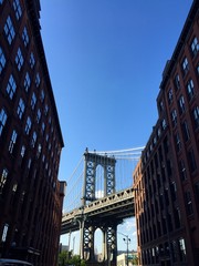 Manhattan bridge between buildings, Brooklyn, New York