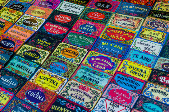 Background of colorful door signs, made in traditional Buenos Aires and Argentina style of painting called fileteado, at a weekend fair in San Telmo neighborhood, Buenos Aires