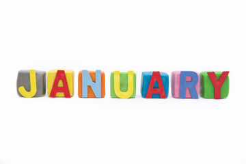 word January by wooden letter on clay