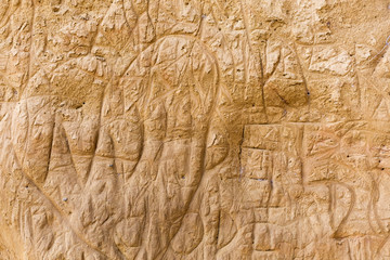scratched mud wall in Tuscany, Italy