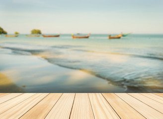 Wood floor top on blue sea in morning light