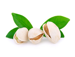 Pistachio nuts with leaf isolated on white