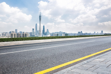 cityscape and skyline of guangzhou from empty asphalt road