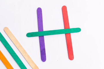 colorful of Ice cream sticks with word H on white background
