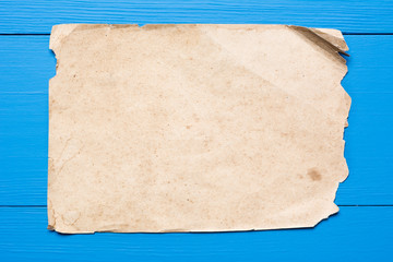 Vintage paper sheet with empty copy space on wooden table