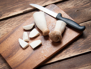 Small pieces King Oyster mushroom (Eringi) on wood backgroud.