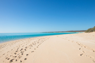 Fototapeta na wymiar Footprints lonely tropical paradise beach