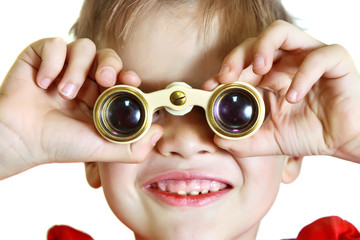 Boy looking through binoculars, close-up
