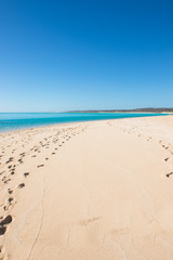 Footprints remote tropical paradise beach