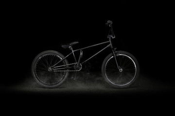 BMX bike on black background with smoke