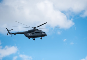 Fototapeta na wymiar Military helicopter in the sky at day time