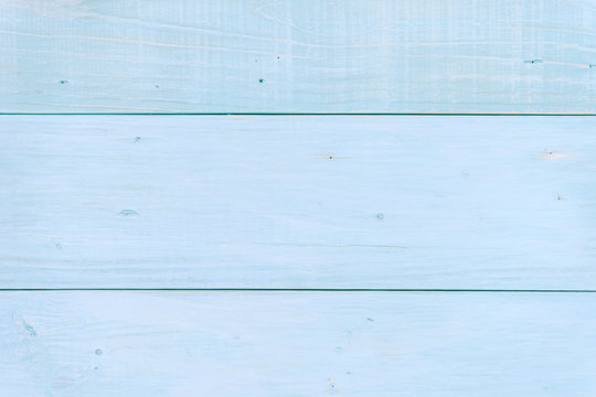 light blue wood background texture with tack was hammered