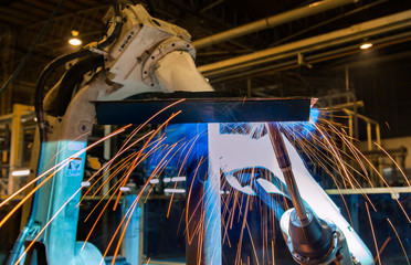 Robot welding steel in factory