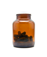 medicine capsule in bottle on white background
