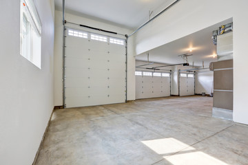 Interior of large three car garage in a brand new house