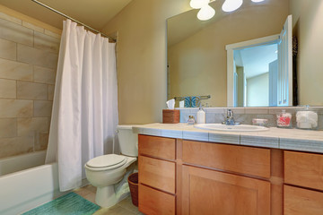 Modern bathroom vanity cabinet with drawers and marble top