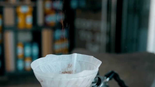 Ground Coffee Is Poured Into a Bowl.