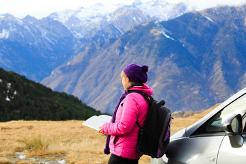 Fototapeta na wymiar young woman travel in winter mountains