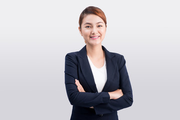 Beautiful asian young business woman on grey background.