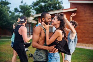 Happy teens dancing and having fun at the picnic area