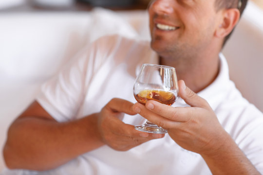 Rich Handsome Man Drinking Whisky Cognac At Elite Club Summer