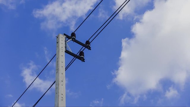 clouds and blue sky and electric pole.