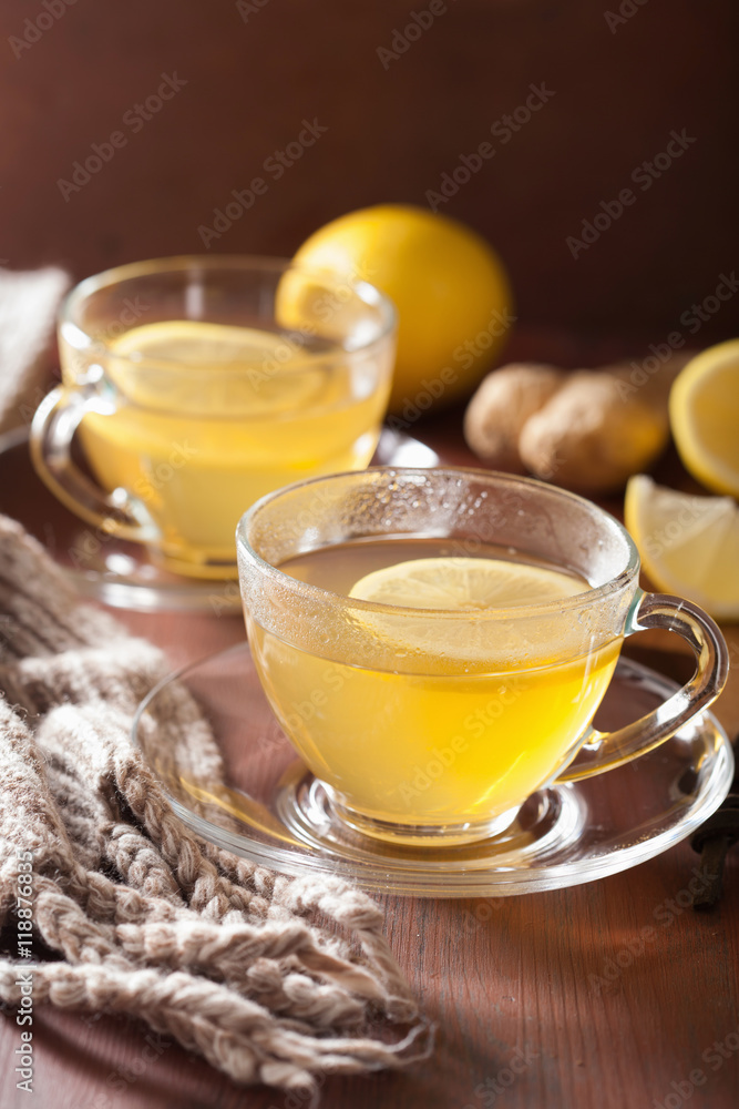 Wall mural hot lemon ginger tea in glass cup