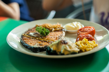 Salmon steak grilled with lemon and Spinach with cheese