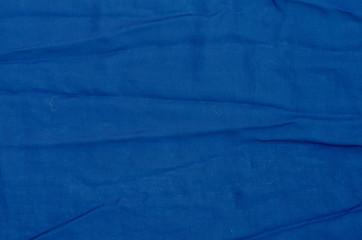 creased dark blue textile background