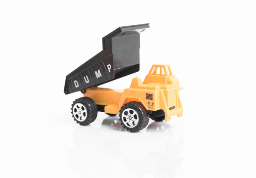 Yellow toy dump truck industrial isolated on white background