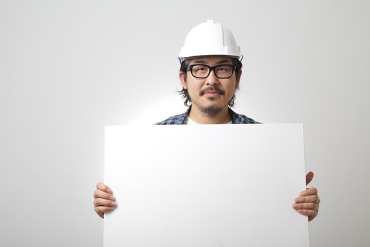The Asian man on the white background.