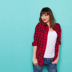 Cheeful Beautiful Girl In Lumberjack Shirt Watching