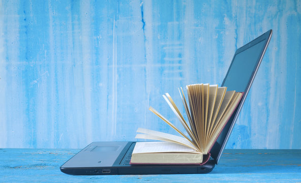 open book and laptop, learning, education, e book concept