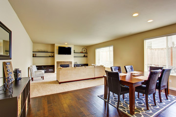 Spacious dining area with table set connected to living room
