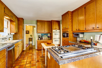 Craftsman kithcen room interior with wooden cabinets, granite counter top
