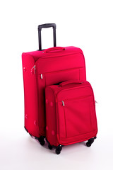 Red travel suitcase isolated on white