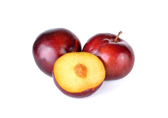red plums isolated on white background