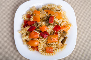 Top view of the Italian pasta fusilli with vegetable sauce