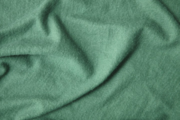 A full page of green fleece fabric texture