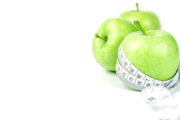 green apple with Measuring tape on white background 