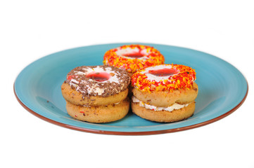 Three delicious cookies lying on blue plate.
