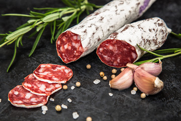 Salami on dark background