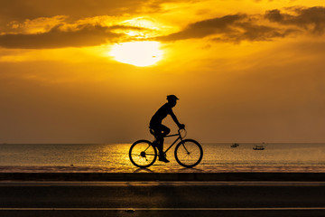 Fototapeta na wymiar Man cycling at beach