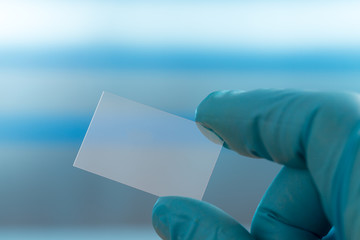 Empty microscope slide in hand