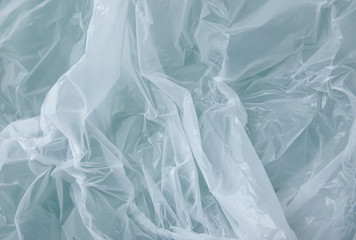 A full page of white plastic bag texture on a green background
