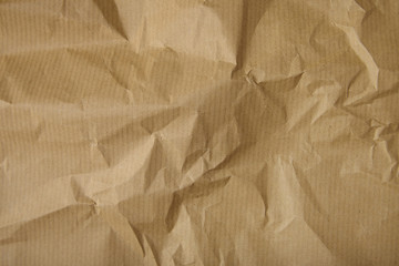 A full page of screwed up brown package paper texture
